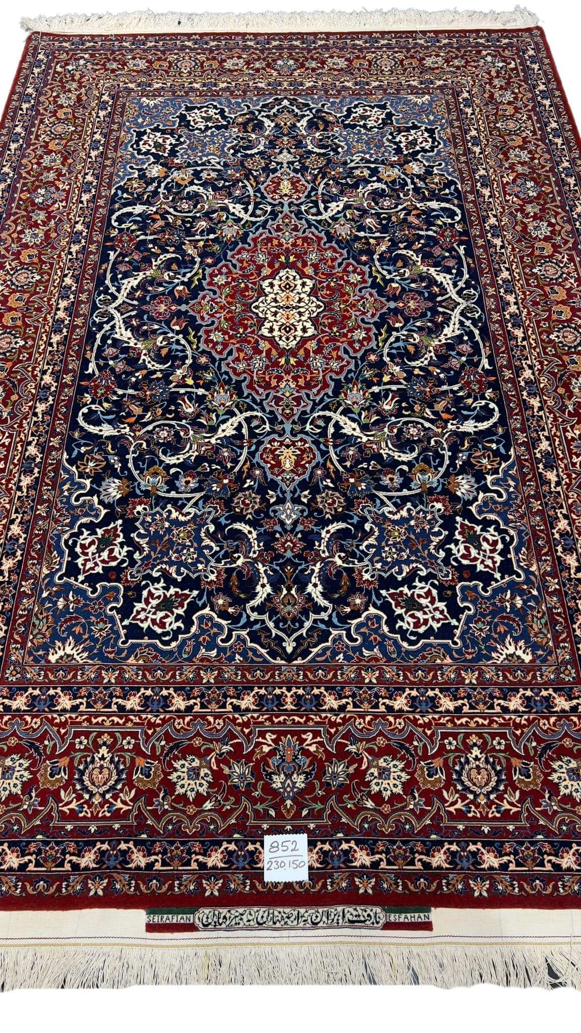 "Hand-knotted Isfahan rug by Master Bagher Seirafian with intricate floral and medallion patterns."